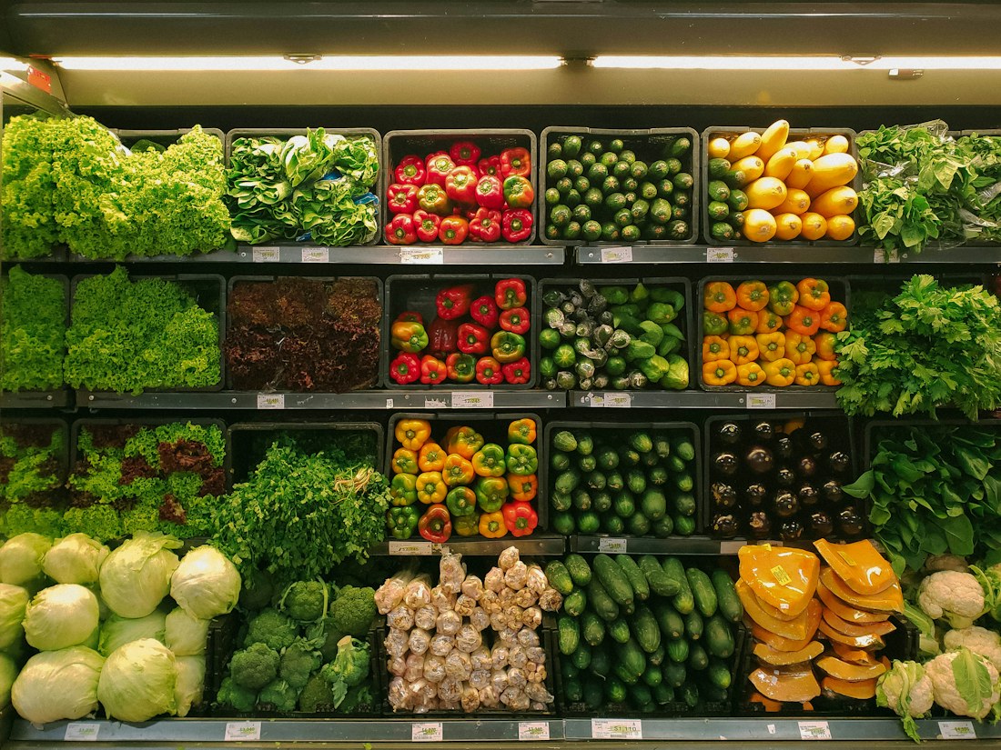 Stocked produce section in a grocery market